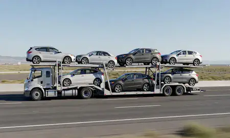 Multi-level car carrier on the highway to Logan, Utah, United States