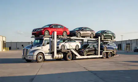 Car transporter loaded with vehicles in Logan, Utah, United States