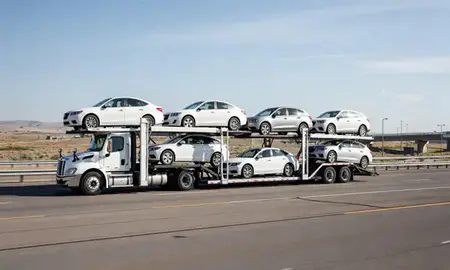 Multi-level car carrier on the highway to Midvale, Utah, United States