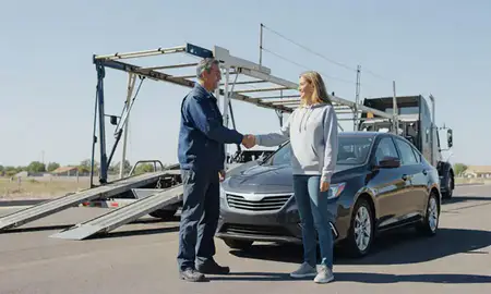 Vehicle owner beside their delivered car in Millcreek, Utah, United States