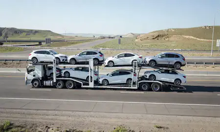 Multi-level car carrier on the highway to Ogden, Utah, United States