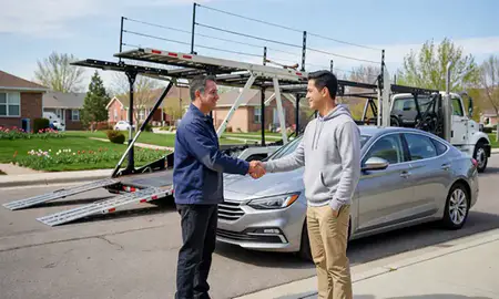 Vehicle owner beside their delivered car in Springville, Utah, United States