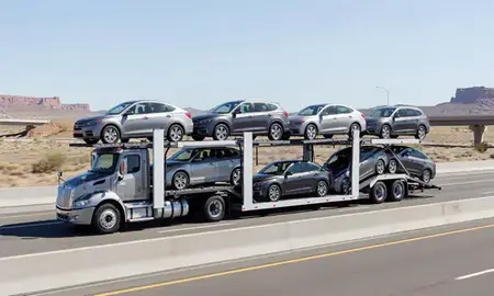Multi-level car carrier on the highway to St. George, Utah, United States