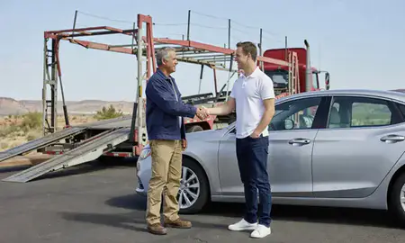 Vehicle owner beside their delivered car in St. George, Utah, United States
