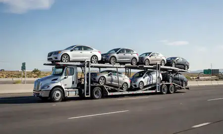 Multi-level car carrier on the highway to Taylorsville, Utah, United States