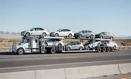 Multi-level car carrier on the highway to West Valley City, Utah, United States
