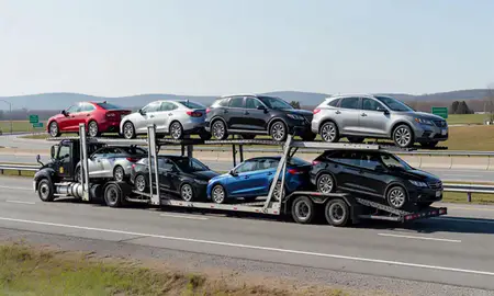 Multi-level car carrier on the highway to Bellows Falls, Vermont, United States