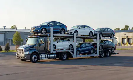 Car transporter loaded with vehicles in Castleton Four Corners, Vermont, United States