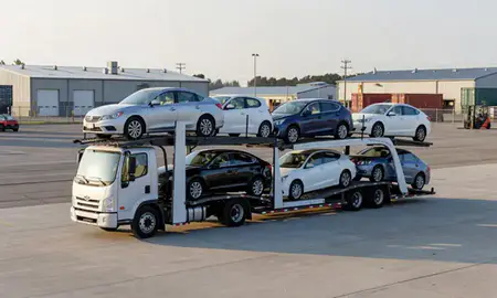 Car transporter loaded with vehicles in Derby Center, Vermont, United States
