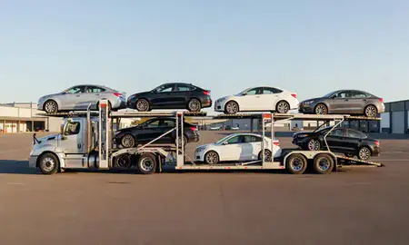Car transporter parked in an industrial area of East Barre, Vermont, United States