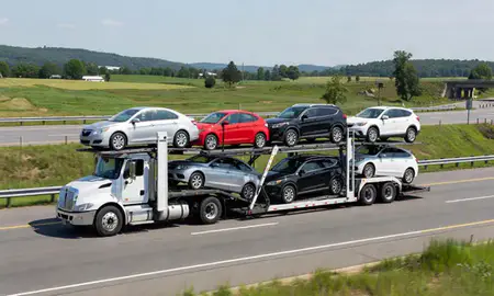 Multi-level car carrier on the highway to Enosburg Falls, Vermont, United States