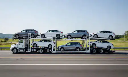 Multi-level car carrier on the highway to Essex Junction, Vermont, United States