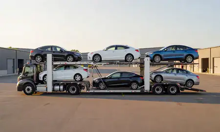 Car transporter parked in an industrial area of Essex Junction, Vermont, United States