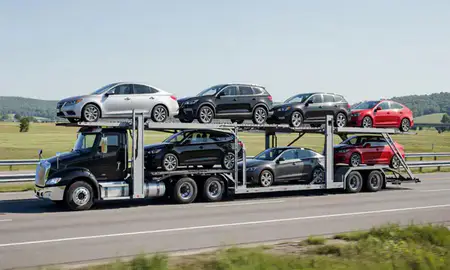 Multi-level car carrier on the highway to Jeffersonville, Vermont, United States