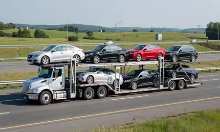 Multi-level car carrier on the highway to Lyndonville, Vermont, United States