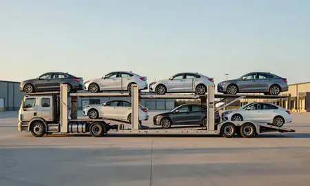 Car transporter parked in an industrial area of Lyndonville, Vermont, United States