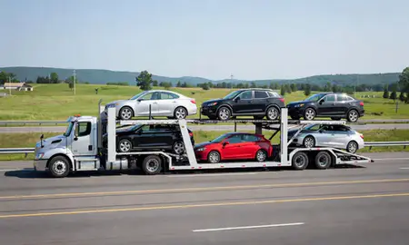 Multi-level car carrier on the highway to Montpelier, Vermont, United States