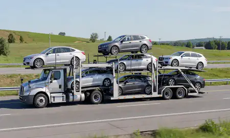 Multi-level car carrier on the highway to Newport, Vermont, United States