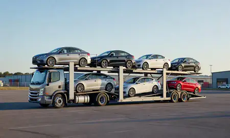 Car transporter loaded with vehicles in Newport, Vermont, United States