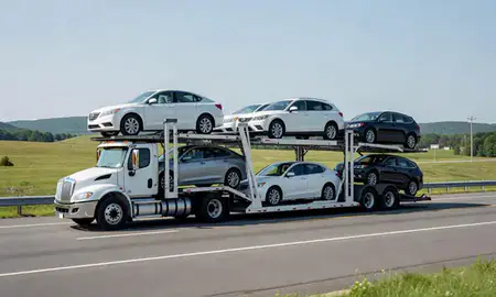 Multi-level car carrier on the highway to North Bennington, Vermont, United States