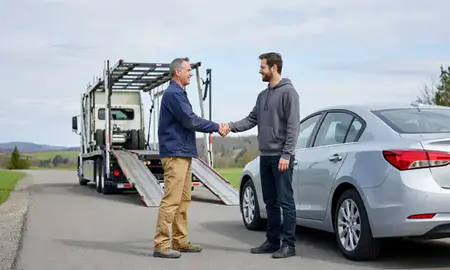 Vehicle owner beside their delivered car in North Bennington, Vermont, United States