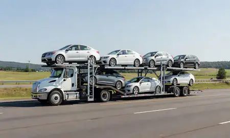 Multi-level car carrier on the highway to Orleans, Vermont, United States