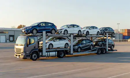 Car transporter loaded with vehicles in Orleans, Vermont, United States