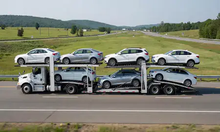 Multi-level car carrier on the highway to Rutland, Vermont, United States