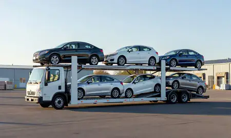 Car transporter loaded with vehicles in Saxtons River, Vermont, United States