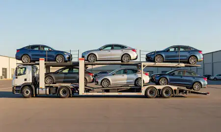 Car transporter parked in an industrial area of South Barre, Vermont, United States