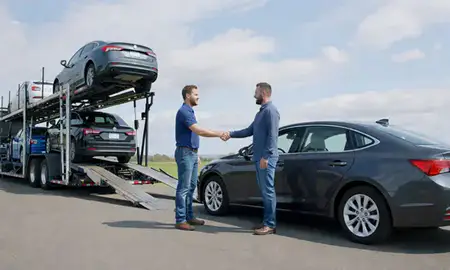 Vehicle owner beside their delivered car in South Burlington, Vermont, United States