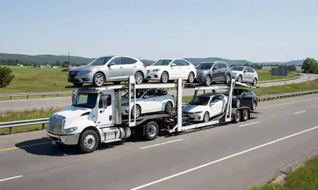 Multi-level car carrier on the highway to St. Albans, Vermont, United States