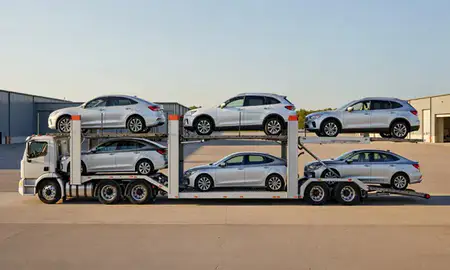 Car transporter parked in an industrial area of St. Albans, Vermont, United States