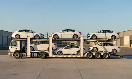 Car transporter parked in an industrial area of Underhill Flats, Vermont, United States