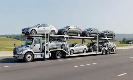 Multi-level car carrier on the highway to Vergennes, Vermont, United States