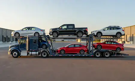 Car transporter parked in an industrial area of West Brattleboro, Vermont, United States
