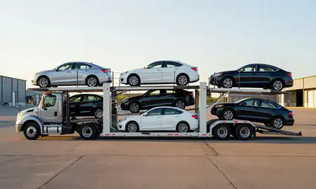 Car transporter parked in an industrial area of White River Junction, Vermont, United States