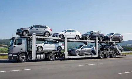 Multi-level car carrier on the highway to Winooski, Vermont, United States