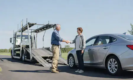 Vehicle owner beside their delivered car in Virginia, United States