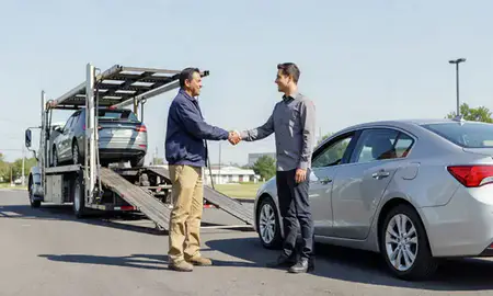 Vehicle owner beside their delivered car in Blacksburg, Virginia, United States