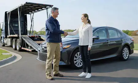 Vehicle owner beside their delivered car in Burke, Virginia, United States