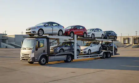 Car transporter loaded with vehicles in Burke, Virginia, United States