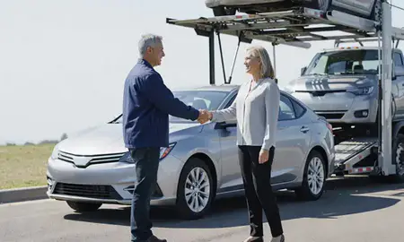 Vehicle owner beside their delivered car in Dale City, Virginia, United States