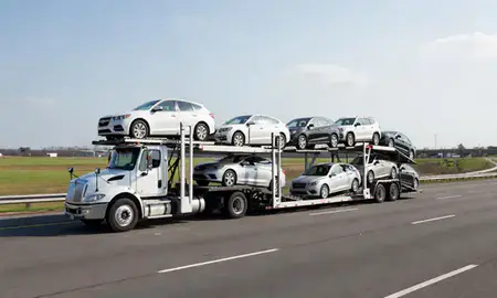 Multi-level car carrier on the highway to Hampton, Virginia, United States