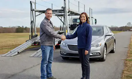Vehicle owner beside their delivered car in Lake Ridge, Virginia, United States