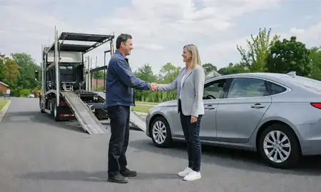 Vehicle owner beside their delivered car in McLean, Virginia, United States