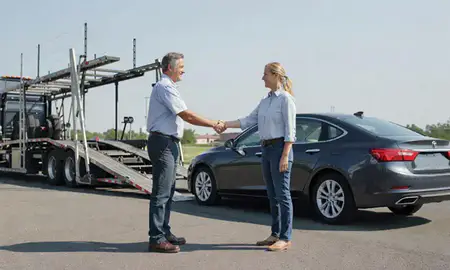 Vehicle owner beside their delivered car in Roanoke, Virginia, United States