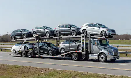Multi-level car carrier on the highway to Suffolk, Virginia, United States