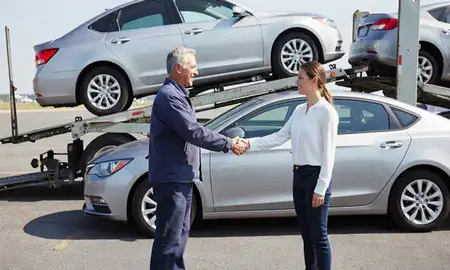 Vehicle owner beside their delivered car in Virginia Beach, Virginia, United States