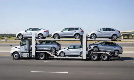 Multi-level car carrier on the highway to Washington, United States